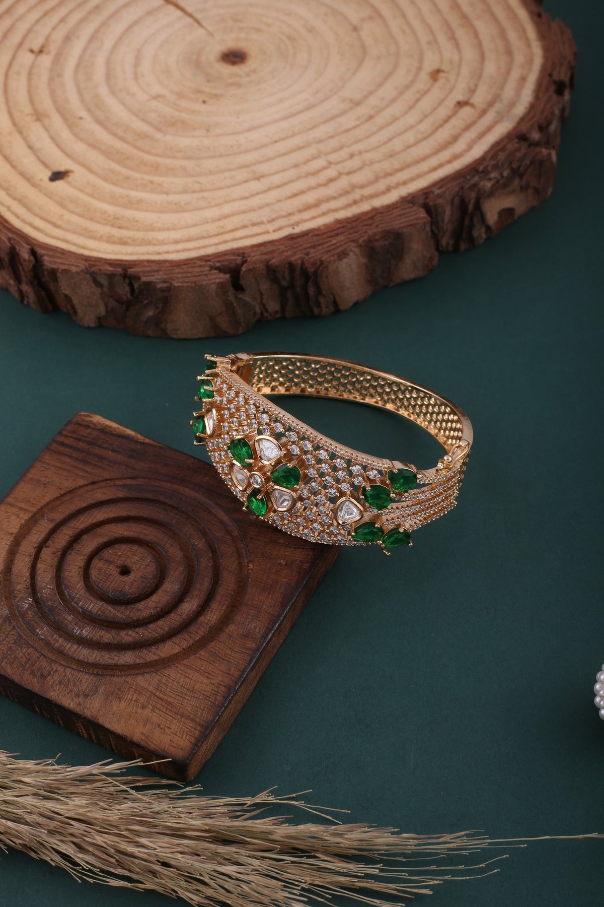 Polki Flower American Diamond Kada - Emerald Green, styled flat lay