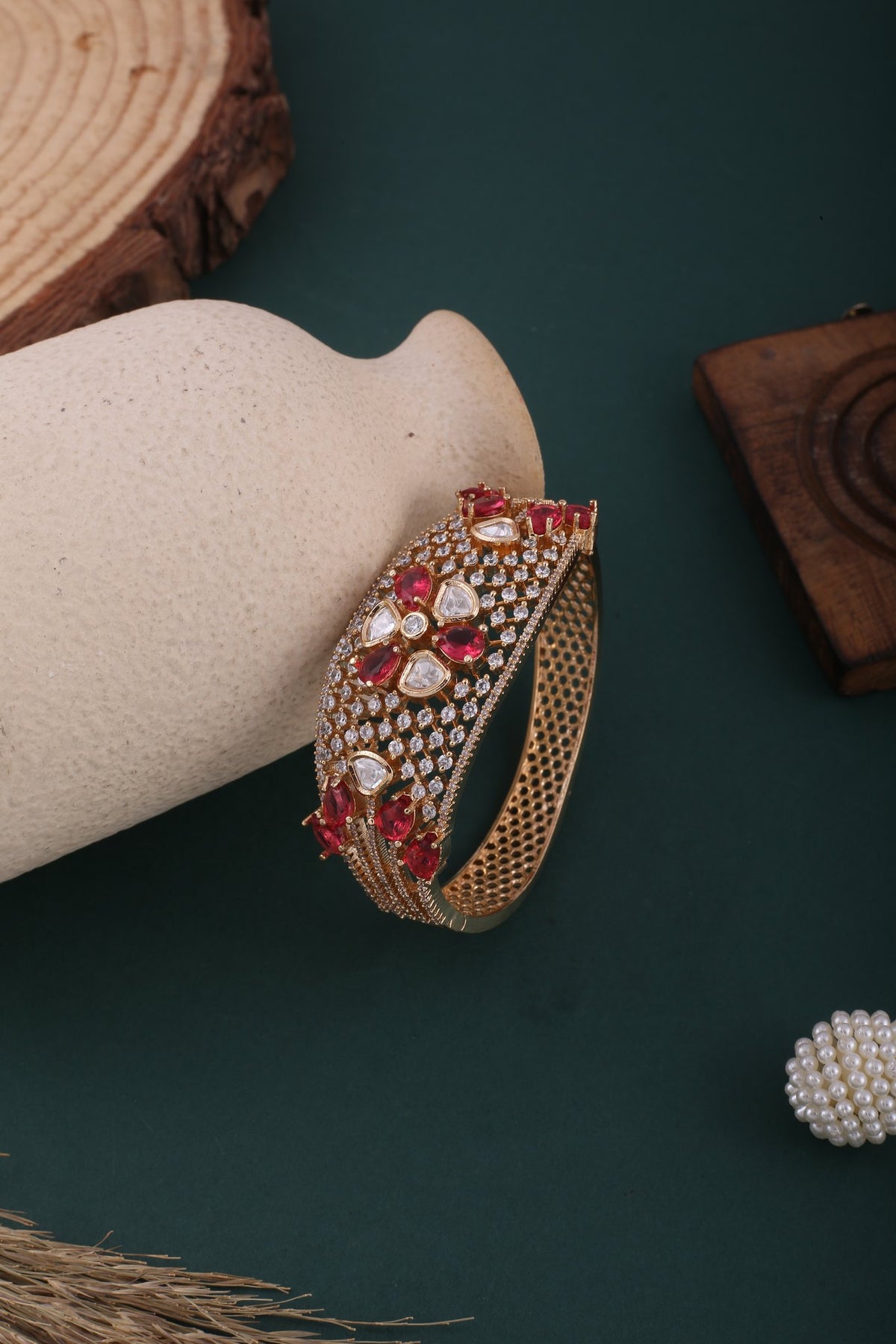 Polki Flower American Diamond Kada - Ruby Red, styled flat lay