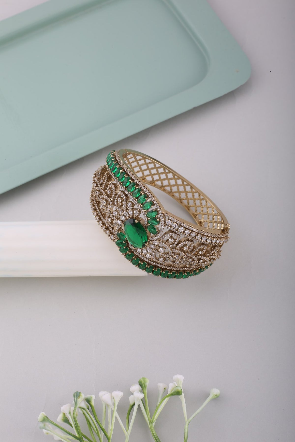 Victorian American Diamond Wave Kada - Emerald Green, styled flat lay