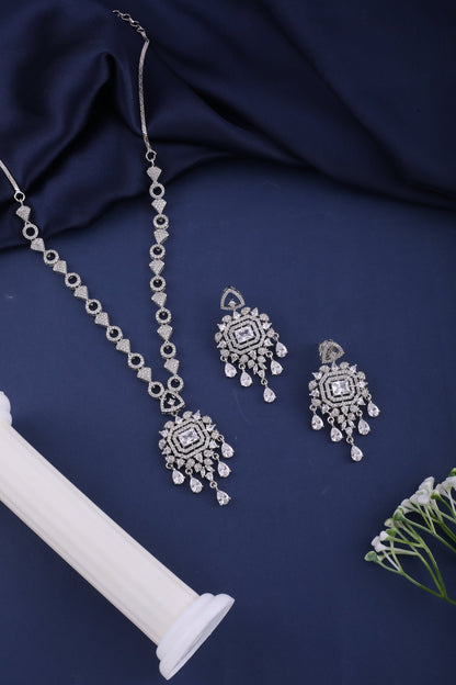 Clear American Diamond Pendant Necklace Set with Chandelier Earrings, styled flat lay