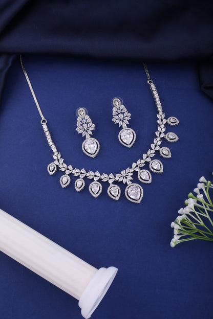 Clear American Diamond Pear Drop Necklace Set, styled flat lay