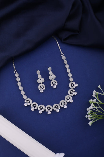 American Diamond Swirl Necklace Set with Drop Earrings, styled flat lay