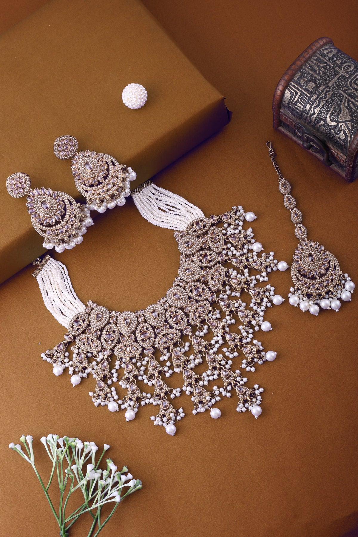 Antique Gold Polki Bridal Necklace Set with Pearl Strands, Chandbalis &amp; Maang Tikka, styled flat lay