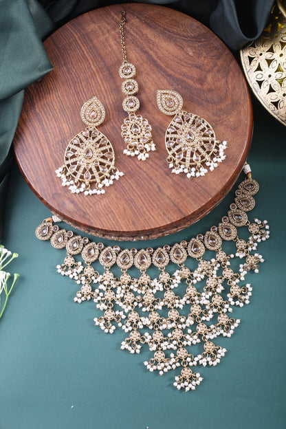 Antique Gold Polki Cascade Bib Necklace Set with Earrings &amp; Maang Tikka, styled flat lay
