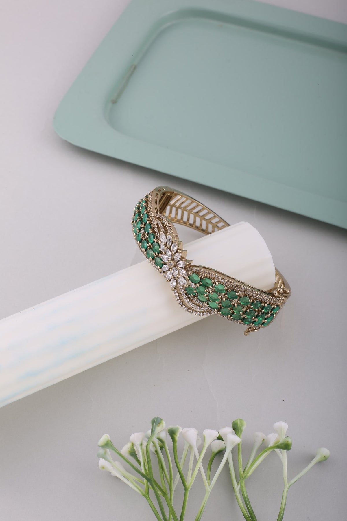 Emerald Green Crossover American Diamond Kada, styled flat lay