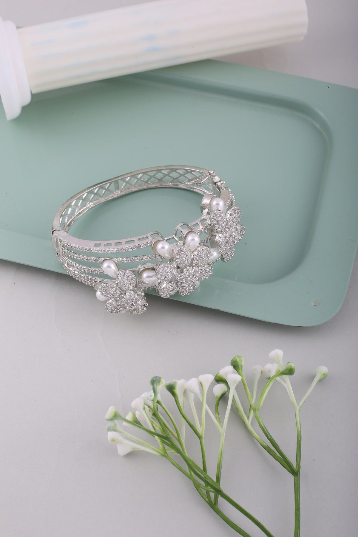 Pearl Flower American Diamond Kada - Silver, styled flat lay