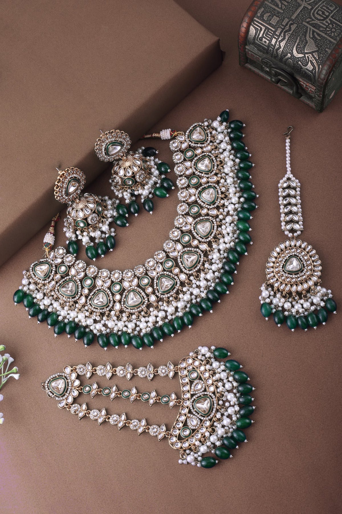 Emerald Polki Bridal Choker Set with Jhumkas, Maang Tikka &amp; Passa, styled flat lay