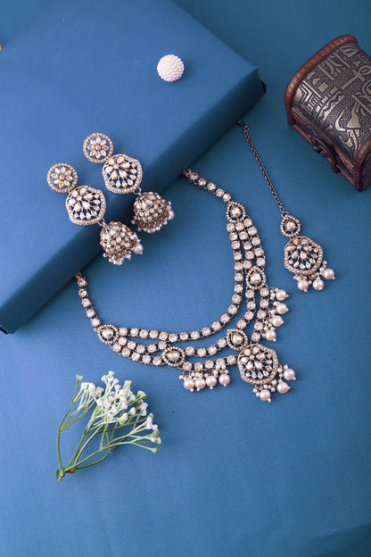 Pearl Three Layer Polki Necklace Set with Jhumkas &amp; Maang Tikka, styled flat lay