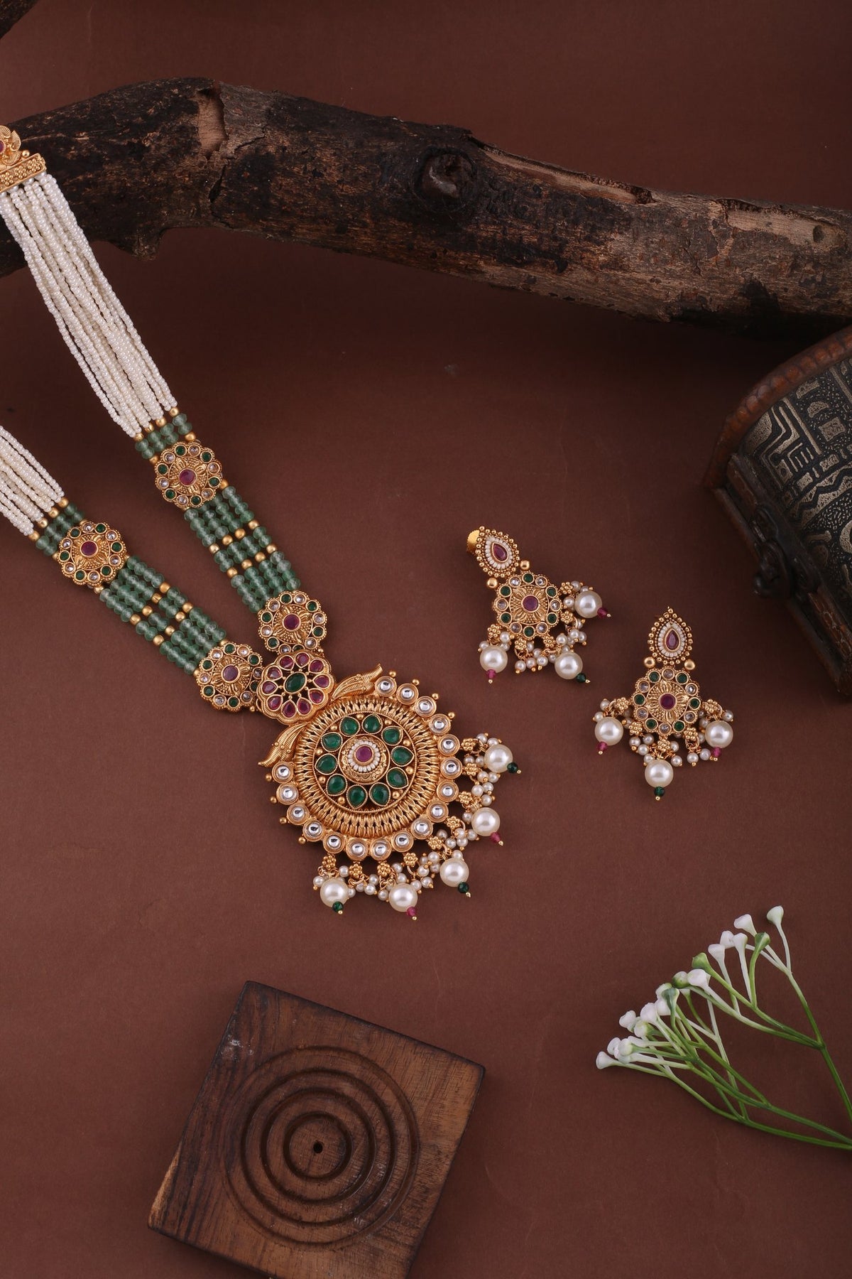 Antique Gold Temple Pendant Long Necklace Set with Pearl &amp; Mint Beads, styled flat lay